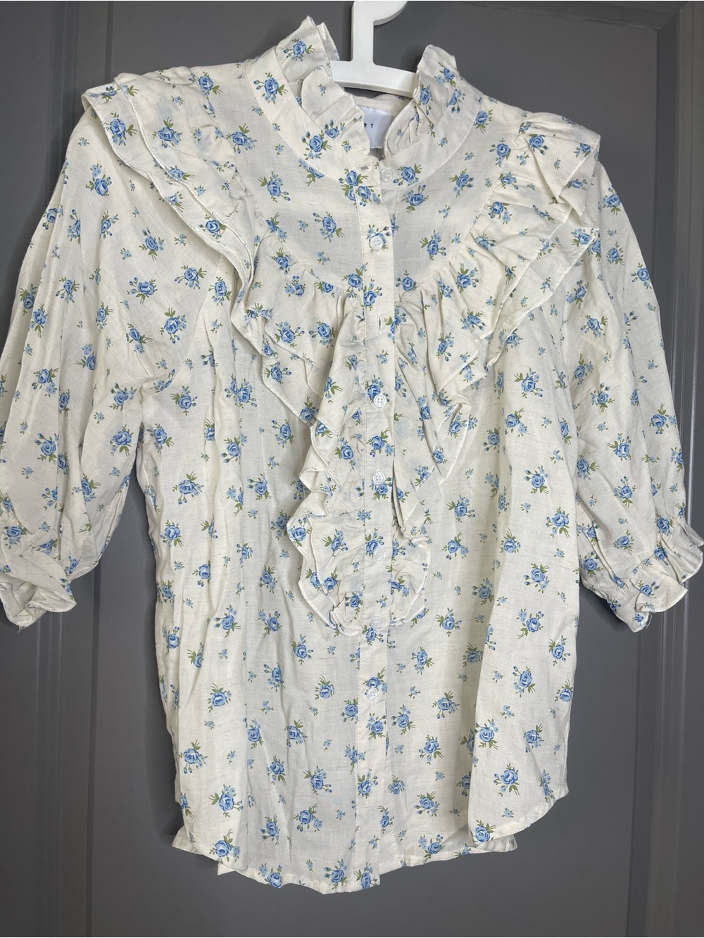 The Shirt by Rochelle Behrens Cream Blouse with Blue Floral Ruffles